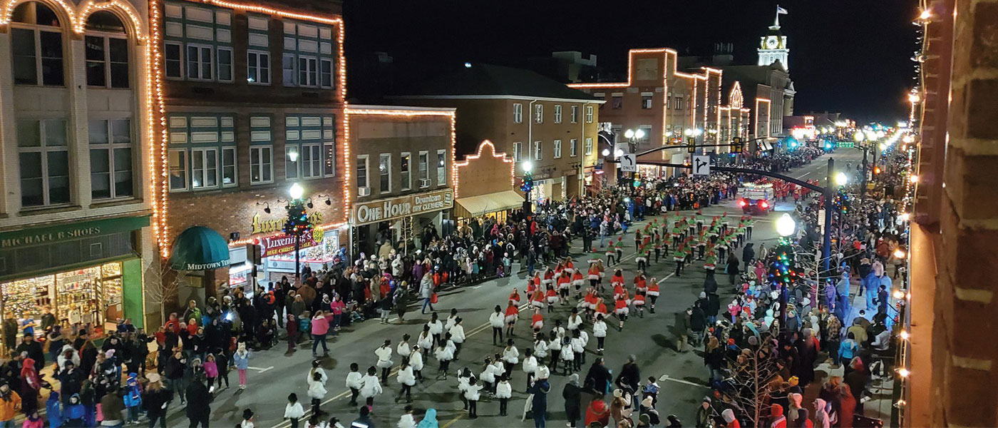 Band marching on Main Street at Night
