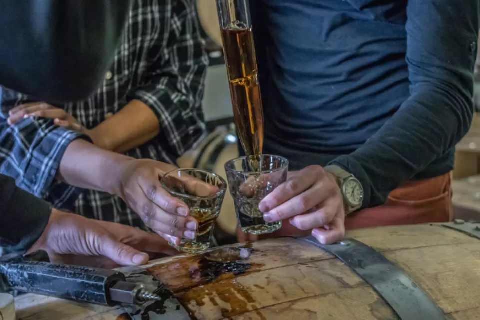 pouring whiskey sampler