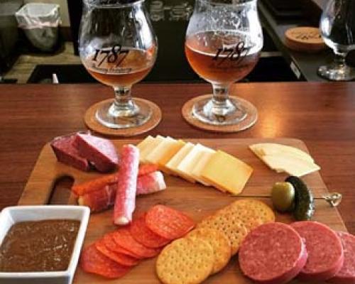 cheese cracker and meat sampler with beer
