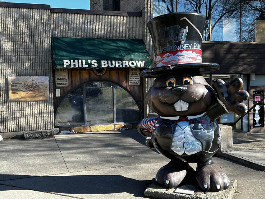 groundhog statue with cap on 