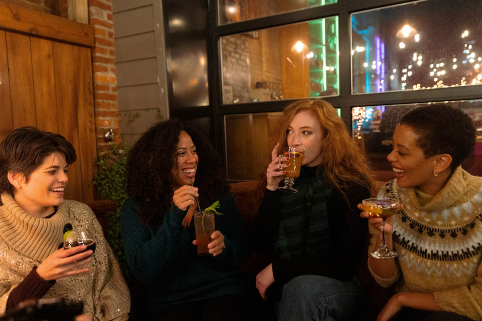 a group of women enjoying drinks