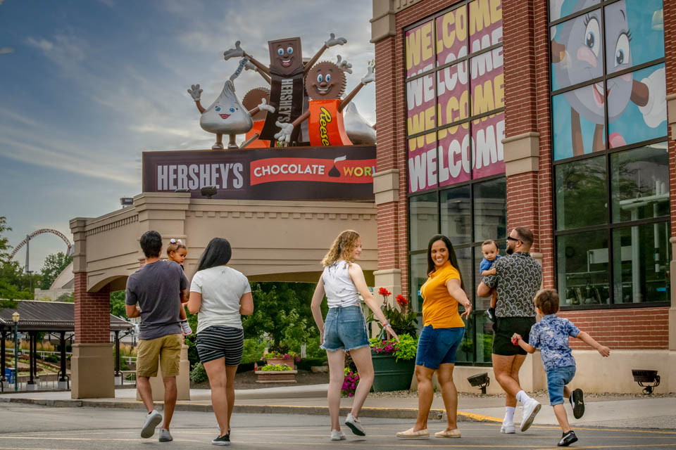 a family walking toward chocolate world