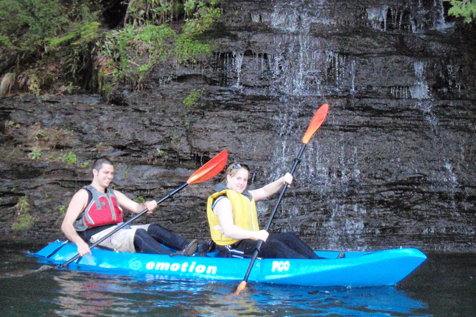 couple kayaking on creek