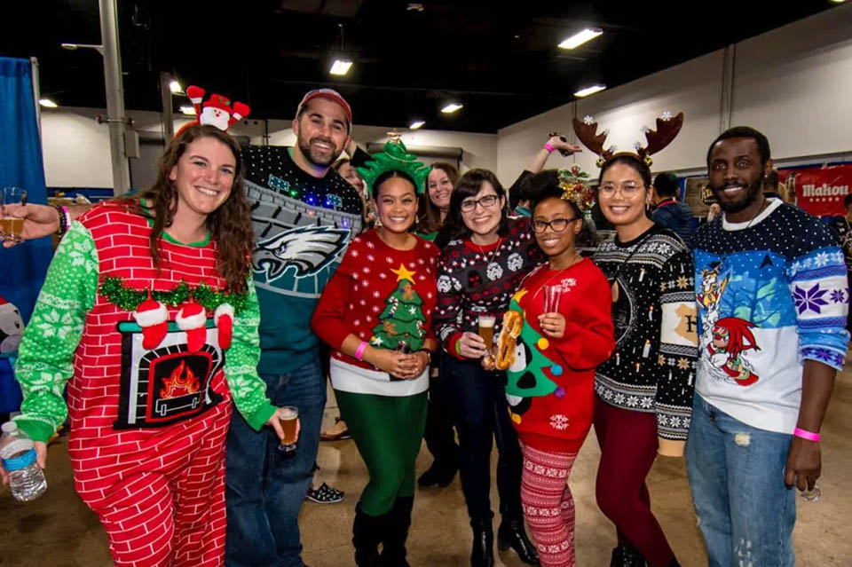 group of people in Christmas Sweaters